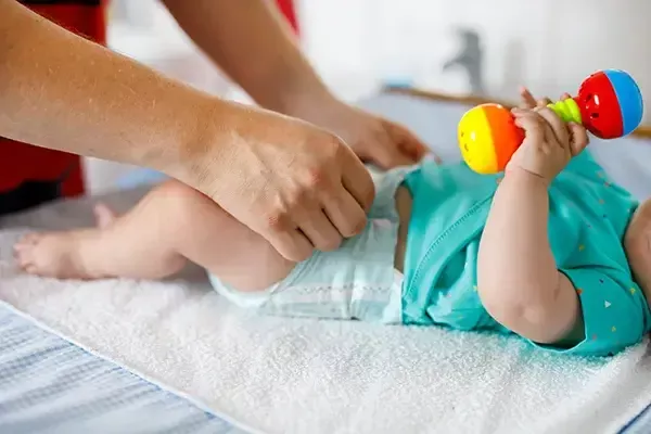 Daddy changing a baby's diaper